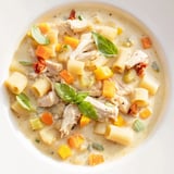 A warm bowl of Marry Me Chicken Soup showcasing tender chicken and creamy broth for a cozy dinner.