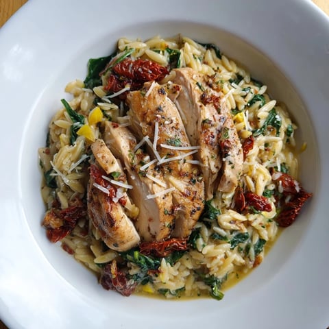 Creamy Marry Me Chicken Orzo, featuring sliced chicken and rich parmesan sauce, ready to serve.