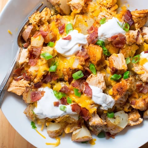 Comforting Cajun Chicken Loaded Potato Bake: diced chicken and potatoes, baked until melty.