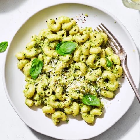 This vibrant Creamy Avocado Pesto Mac features tender pasta tossed in a luscious, bright green avocado and basil sauce.  