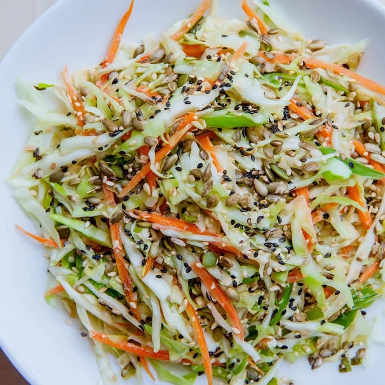 This delicious, colorful Cabbage-Core Slaw Salad features shredded cabbage and a flavorful, tangy dressing.