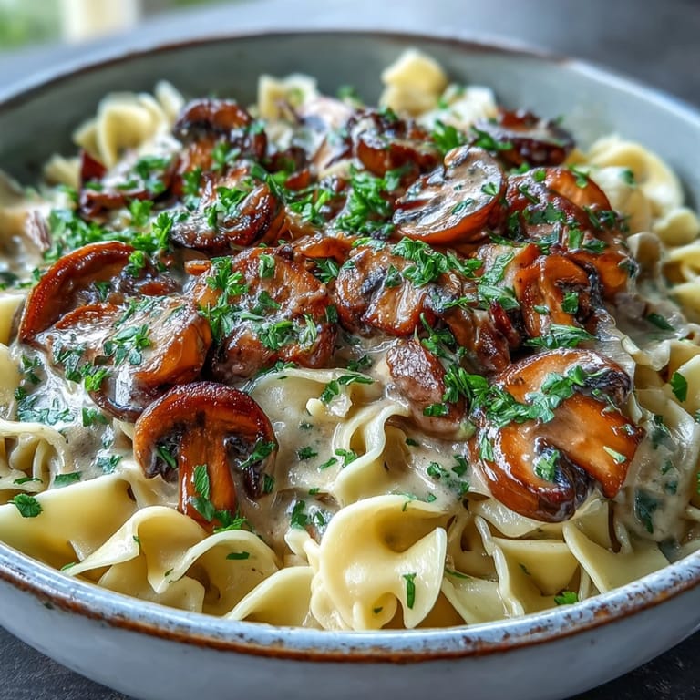 Savory Creamy Mushroom Stroganoff served hot, garnished with fresh parsley and cracked black pepper, ready for a comforting dinner.